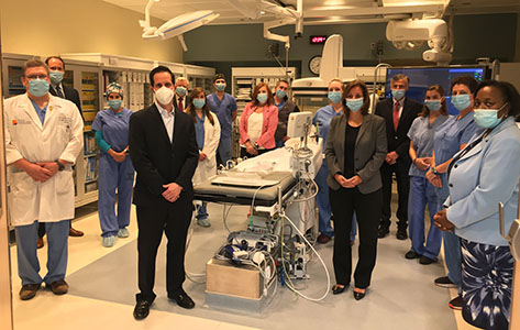 Hospital leadership along with cardiac cath lab physicians and team members celebrate the launch of its new PCI program at Newton Medical Center.