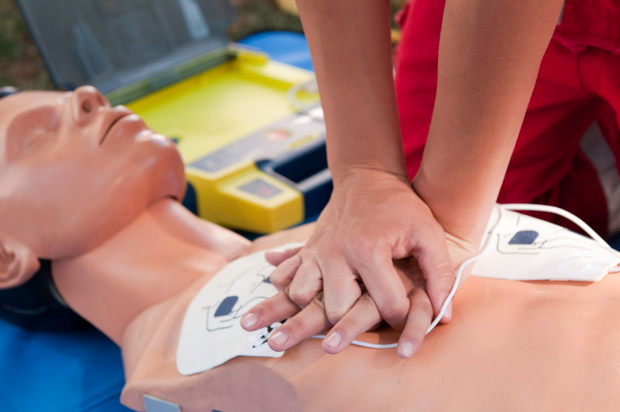 Person demonstrates hands-only CPR technique