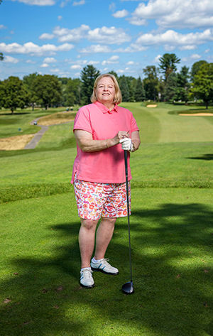Kathy playing golf