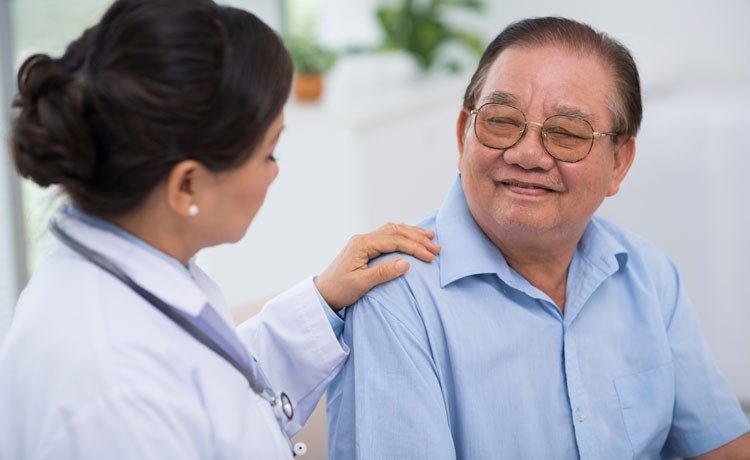Doctor consoles cancer patient