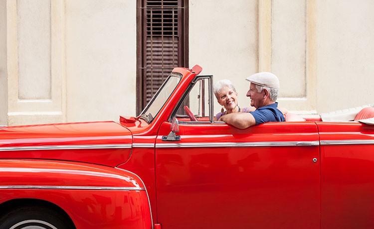 Elderly couple driving their car