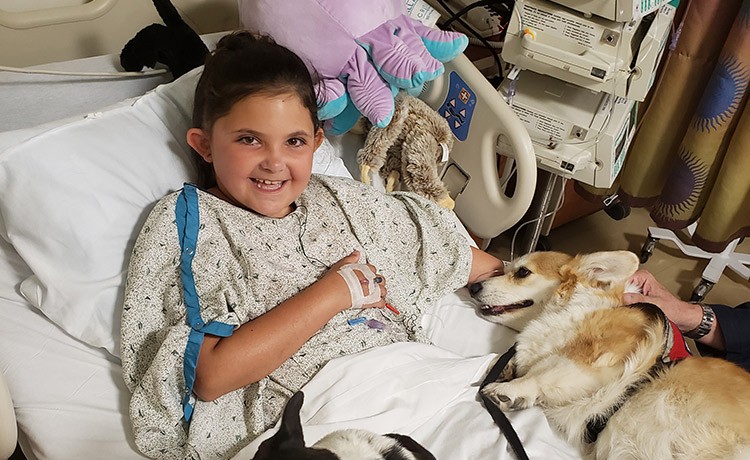 Goryeb brain tumor patient with pet therapy dog