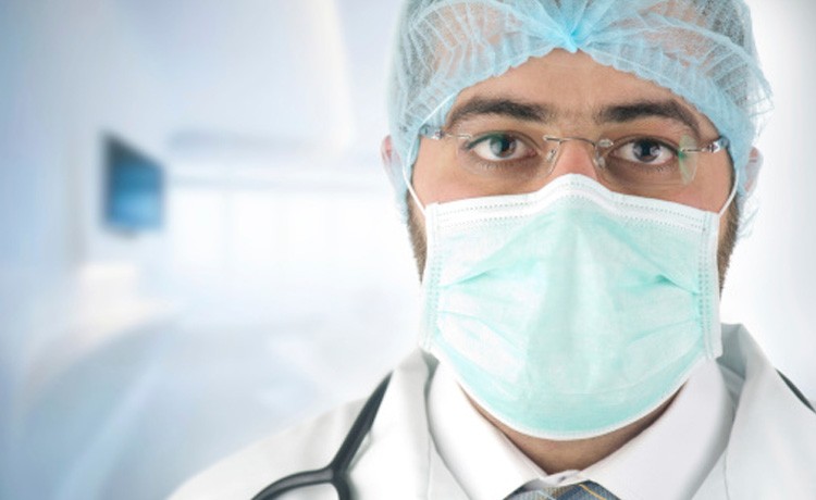 Doctor with mask and hair net
