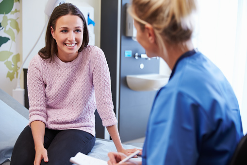 woman talking with nurse