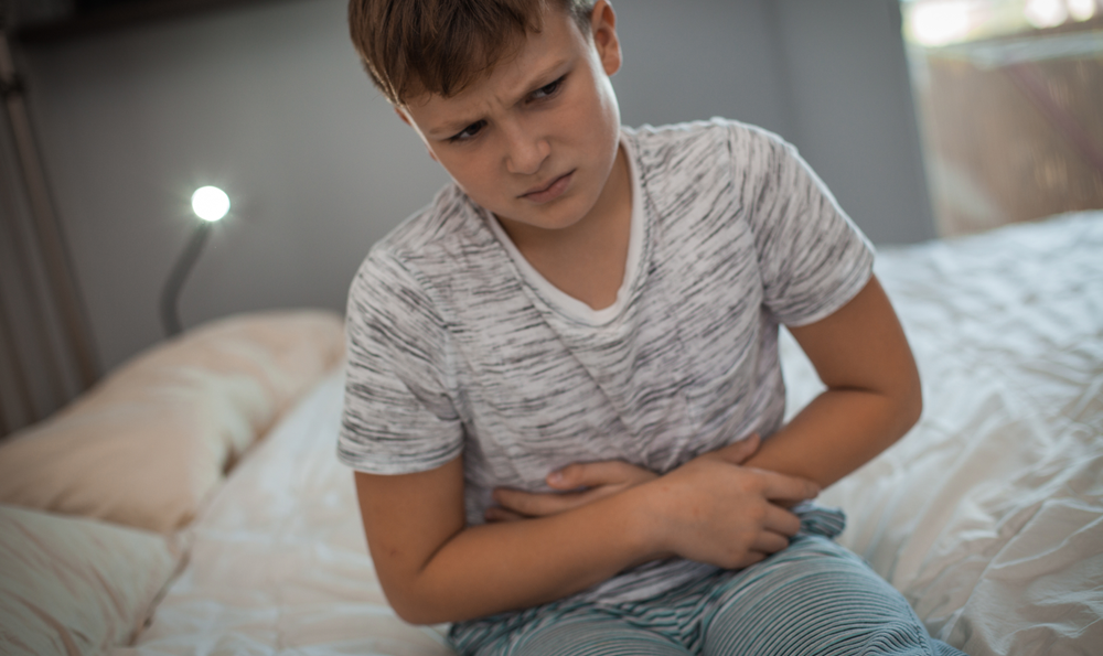 A child holding his stomach
