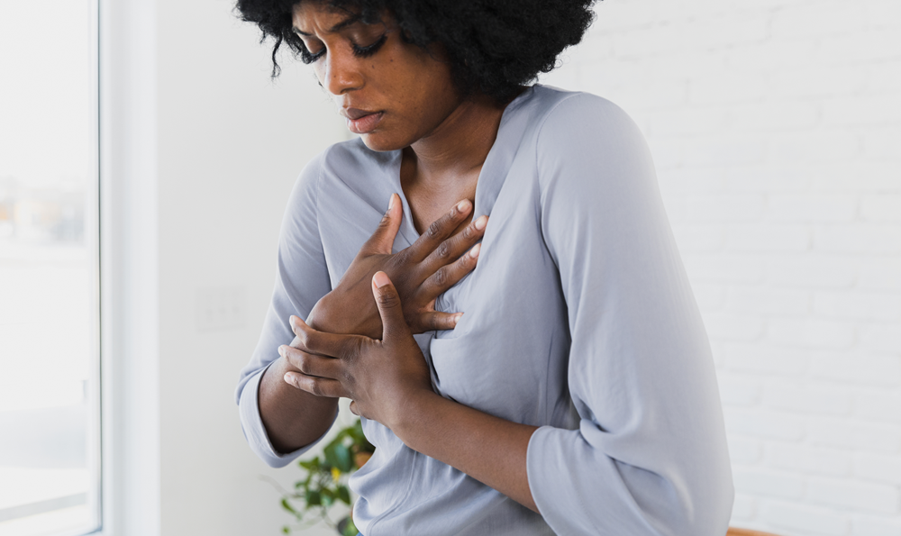 A woman holding her chest