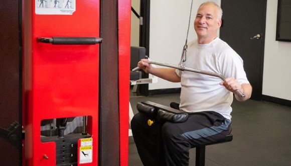 Jay exercising at the gym.
