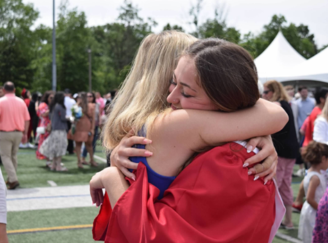 Rachel hugging a woman