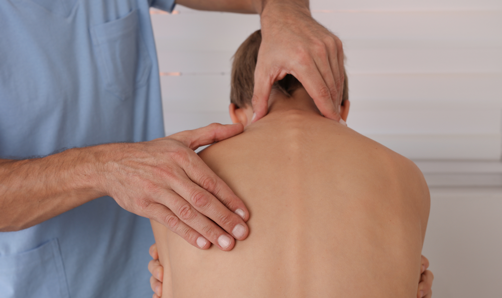 A child being checked for scoliosis