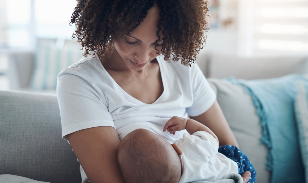 A woman breastfeeding an infant