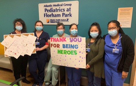 medical team with thank-you gift from daycare