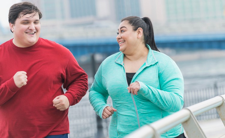 overweight couple jogging