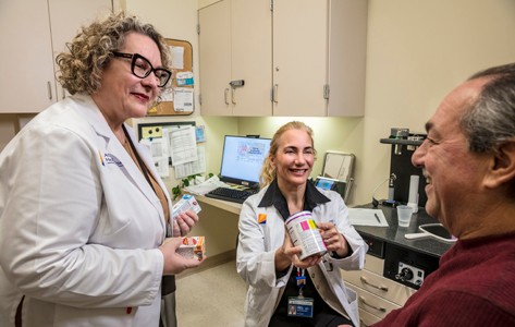 Doctor with patient performing a technique