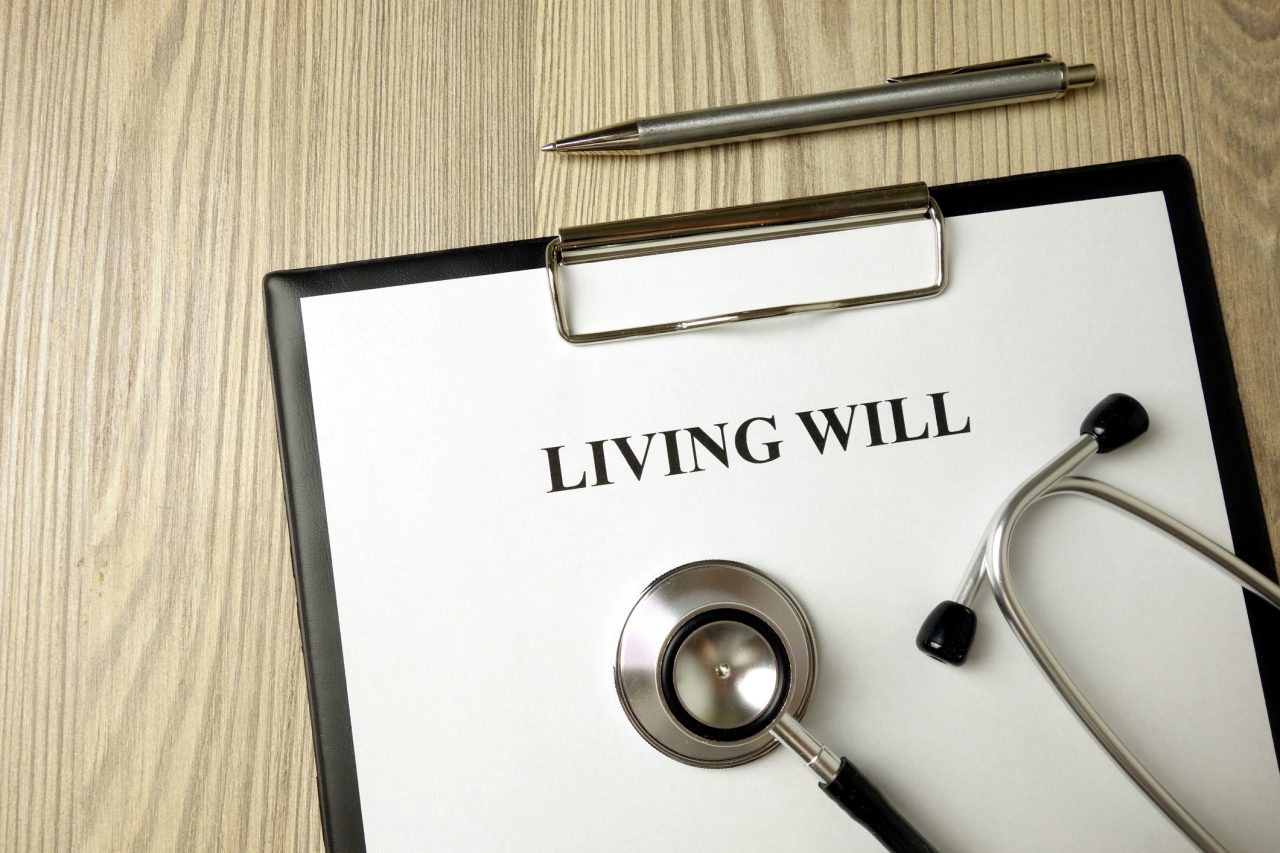 Living will directive with stethoscope and pen.