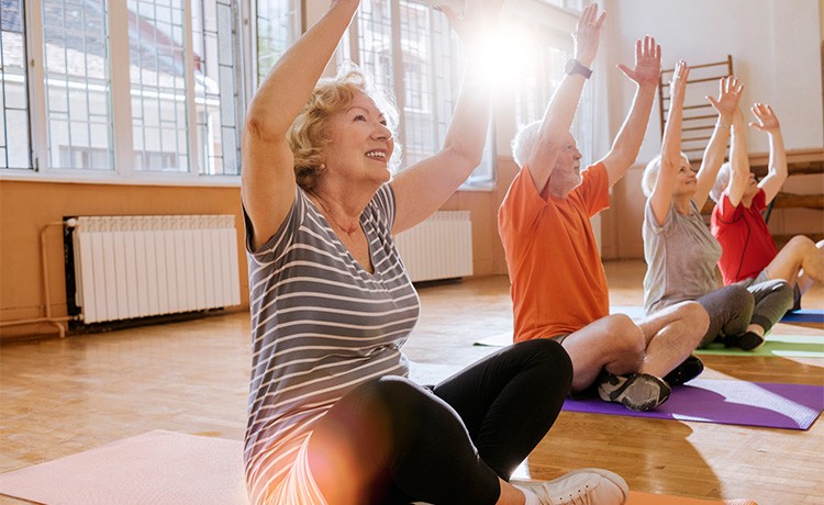 Woman stretches in fitness class